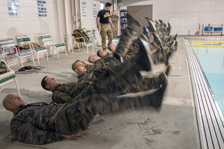Airmen perform flutter kicks alongside a pool during a water survival assessment, Feb. 9, 2018, at Moody Air Force Base, Ga. The assessment is part of a three-day ranger assessment that’s designed to determine whether Airmen are ready to attend the Air Force pre Ranger-Assessment Course held at Fort Bliss Army post, Texas. The Ranger cadre test Airmen’s physical fitness, tactical abilities, land navigation skills, leadership qualities, water confidence and academic ability to determine if they have the knowledge and will to become Ranger qualified. (U.S. Air Force photo by Airman Eugene Oliver)