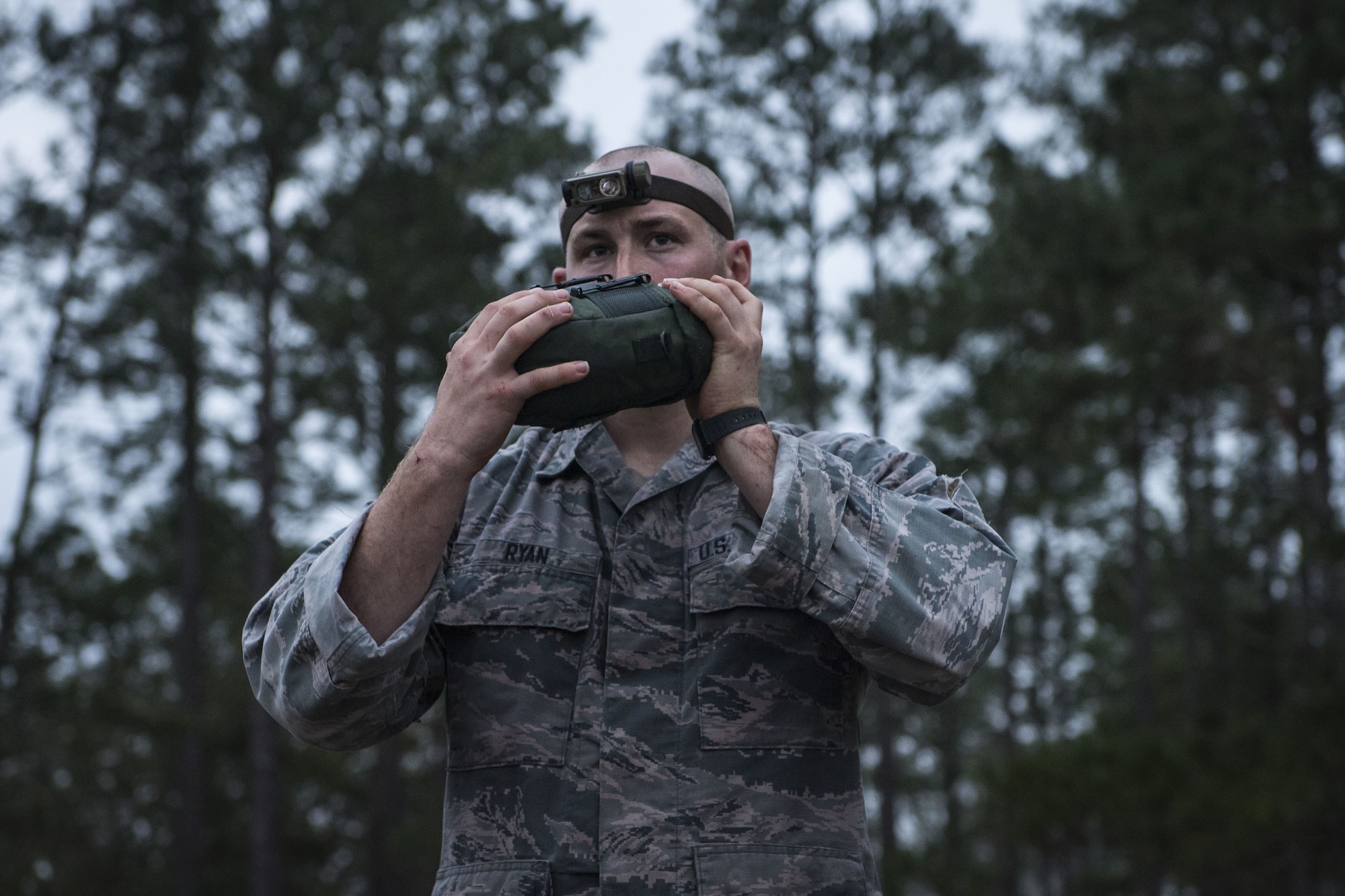 An Airman hydrates after completing a 12-mile ruck march during a Pre Ranger Assessment Course, Feb. 11, 2018, at Moody Air Force Base, Ga. The three-day assessment is designed to determine whether Airmen are ready to attend the Air Force Ranger Assessment Course held at Fort Bliss Army Post, Texas. Ranger cadre test Airmen’s physical fitness, tactical abilities, land navigation skills, leadership qualities, water confidence and academic ability to determine if they have the knowledge and will to become Rangers. (U.S. Air Force photo by Senior Airman Janiqua P. Robinson)
