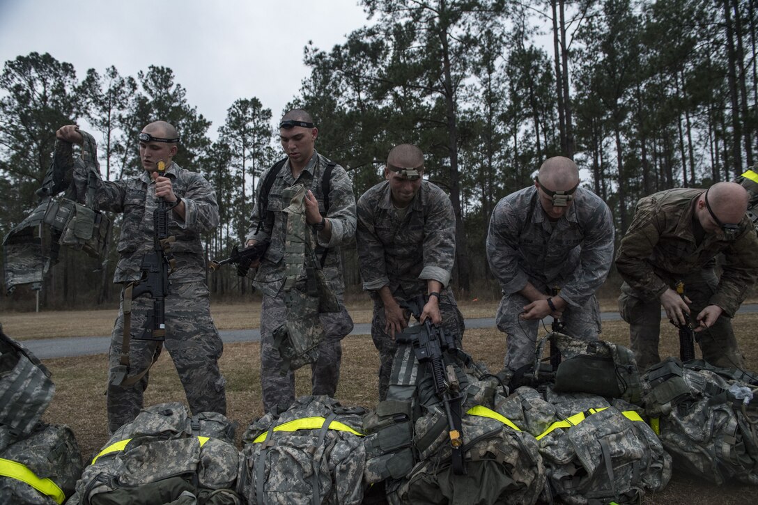 Airmen don gear during a Pre Ranger Assessment Course, Feb. 11, 2018, at Moody Air Force Base, Ga. The three-day assessment is designed to determine whether Airmen are ready to attend the Air Force Ranger Assessment Course held at Fort Bliss Army Post, Texas. Ranger cadre test Airmen’s physical fitness, tactical abilities, land navigation skills, leadership qualities, water confidence and academic ability to determine if they have the knowledge and will to become Rangers. (U.S. Air Force photo by Senior Airman Janiqua P. Robinson)