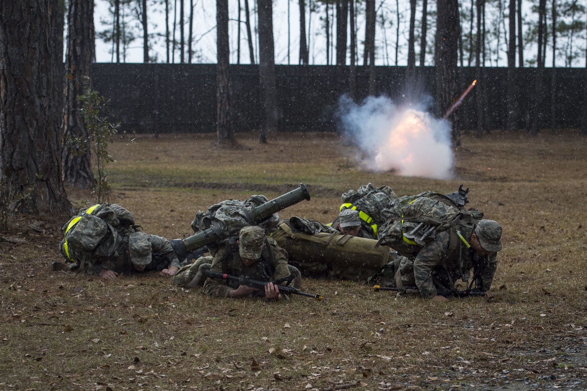 Airmen duck for cover as a non-lethal grenade explodes during a Pre Ranger Assessment Course, Feb. 11, 2018, at Moody Air Force Base, Ga. The three-day assessment is designed to determine whether Airmen are ready to attend the Air Force Ranger Assessment Course held at Fort Bliss Army Post, Texas. Ranger cadre test Airmen’s physical fitness, tactical abilities, land navigation skills, leadership qualities, water confidence and academic ability to determine if they have the knowledge and will to become Rangers. (U.S. Air Force photo by Senior Airman Janiqua P. Robinson)
