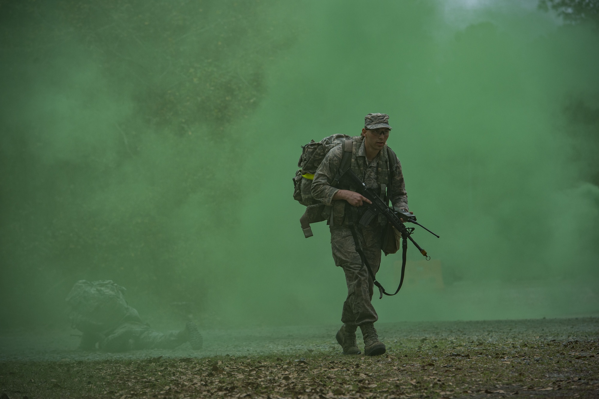 An Airman treks through smoke during a Pre Ranger Assessment Course, Feb. 11, 2018, at Moody Air Force Base, Ga. The three-day assessment is designed to determine whether Airmen are ready to attend the Air Force Ranger Assessment Course held at Fort Bliss Army Post, Texas. Ranger cadre test Airmen’s physical fitness, tactical abilities, land navigation skills, leadership qualities, water confidence and academic ability to determine if they have the knowledge and will to become Rangers. (U.S. Air Force photo by Senior Airman Janiqua P. Robinson)