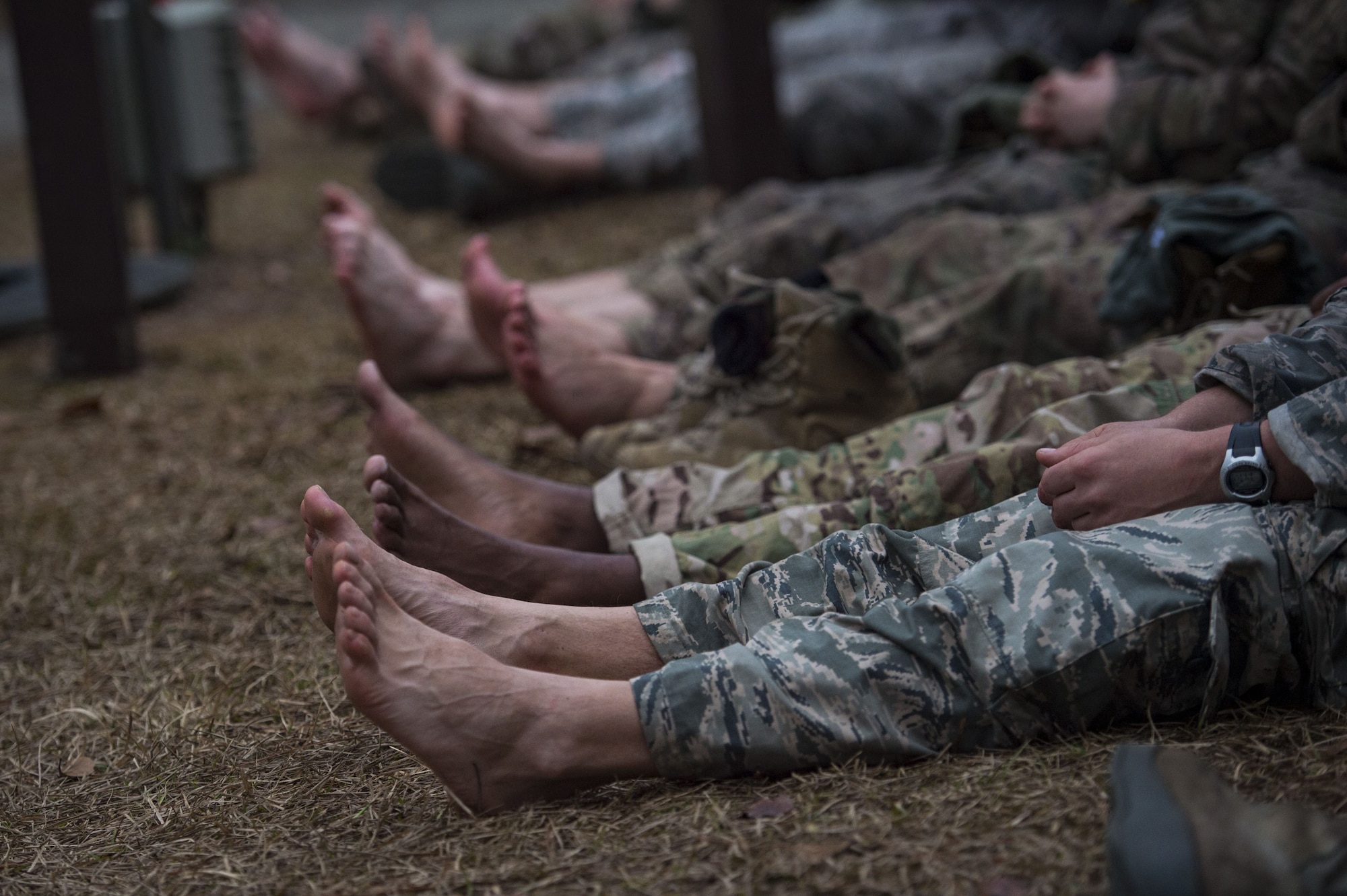 Airmen air out their feet during a Pre Ranger Assessment Course, Feb. 11, 2018, at Moody Air Force Base, Ga. The three-day assessment is designed to determine whether Airmen are ready to attend the Air Force Ranger Assessment Course held at Fort Bliss Army Post, Texas. Ranger cadre test Airmen’s physical fitness, tactical abilities, land navigation skills, leadership qualities, water confidence and academic ability to determine if they have the knowledge and will to become Rangers. (U.S. Air Force photo by Senior Airman Janiqua P. Robinson)