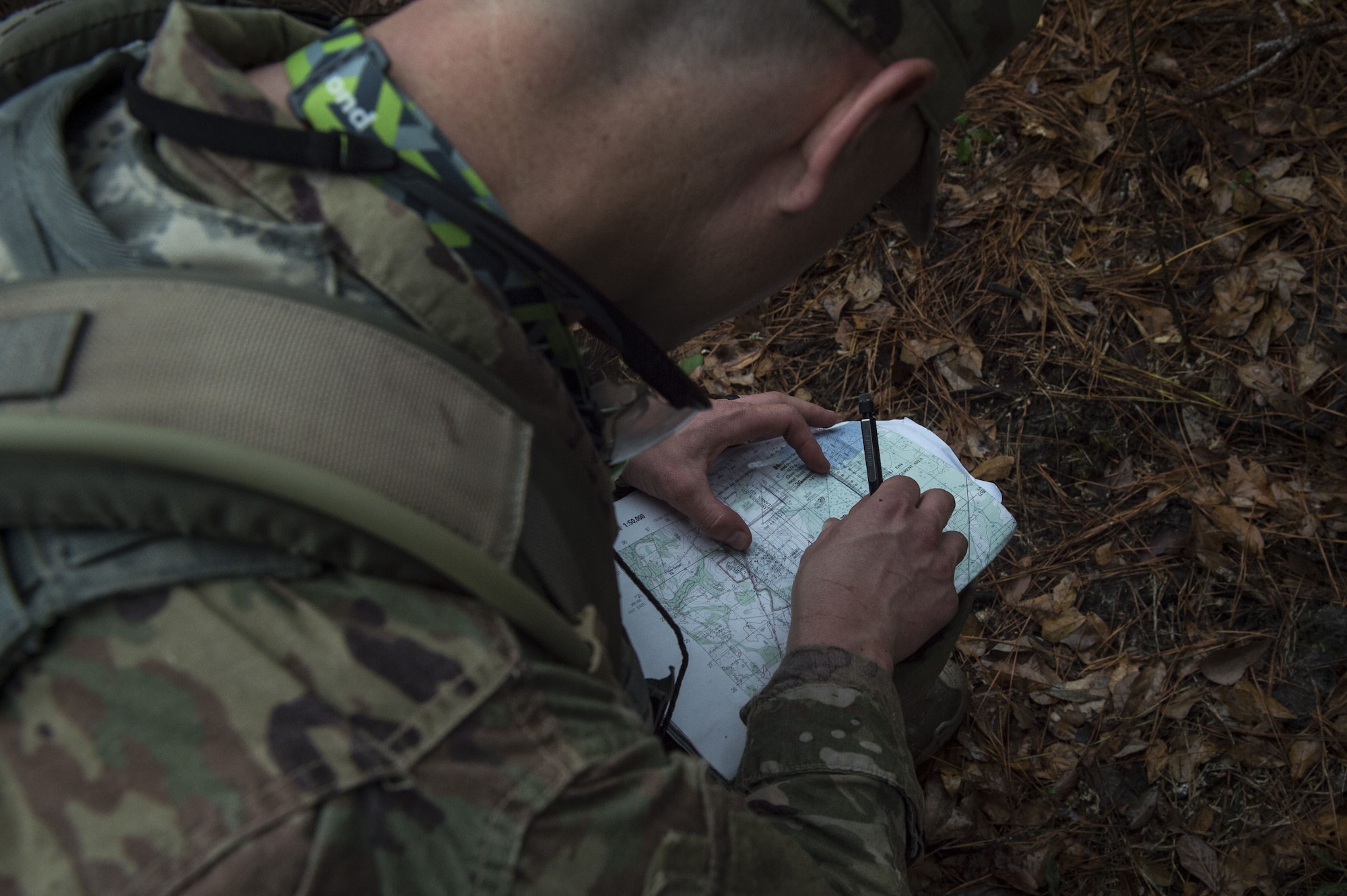 An Airman uses a protractor to calculate distance during a Pre Ranger Assessment Course, Feb. 10, 2018, at Moody Air Force Base, Ga. The three-day assessment is designed to determine whether Airmen are ready to attend the Air Force Ranger Assessment Course held at Fort Bliss Army Post, Texas. Ranger cadre test Airmen’s physical fitness, tactical abilities, land navigation skills, leadership qualities, water confidence and academic ability to determine if they have the knowledge and will to become Rangers. (U.S. Air Force photo by Senior Airman Janiqua P. Robinson)