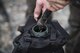 An Airman fills a portable canteen during a Pre Ranger Assessment Course, Feb. 10, 2018, at Moody Air Force Base, Ga. The three-day assessment is designed to determine whether Airmen are ready to attend the Air Force Ranger Assessment Course held at Fort Bliss Army Post, Texas. Ranger cadre test Airmen’s physical fitness, tactical abilities, land navigation skills, leadership qualities, water confidence and academic ability to determine if they have the knowledge and will to become Rangers. (U.S. Air Force photo by Senior Airman Janiqua P. Robinson)