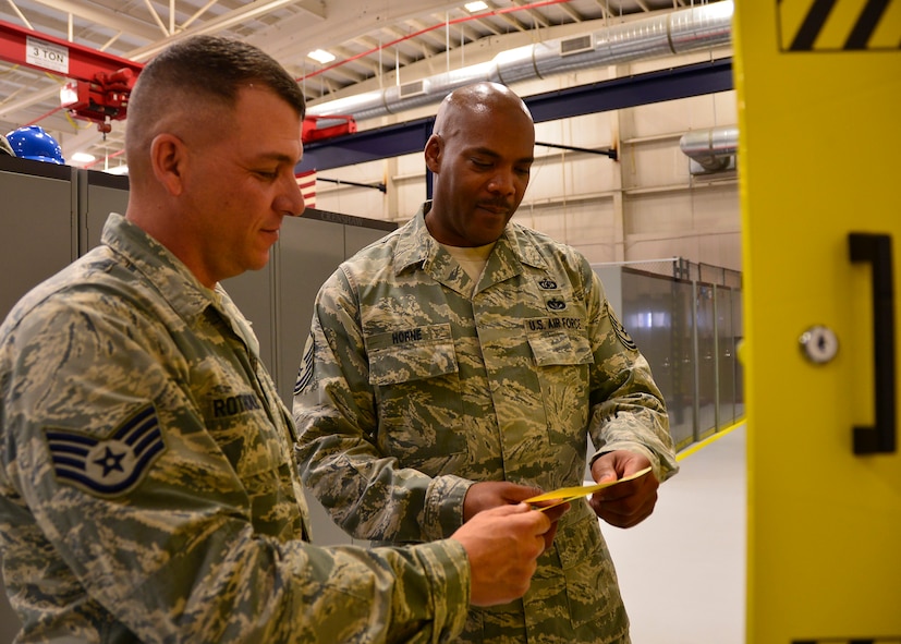 Master Sgt. James Horne, a 919th Special Operations Wing occupational safety specialist, right, conducts an annual facility inspection