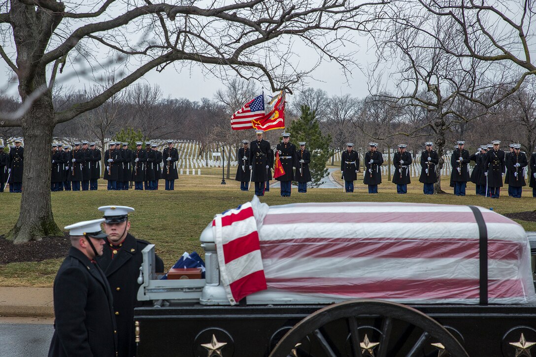 Marine Corps Body Bearers, Bravo Company, Marine Barracks Washington D.C., prepare to march behind the Caisson platoon during a full honors funeral for Col. Travis M. Provost at Arlington National Cemetery, Arlington, Va., Feb. 12, 2018. Provost joined the U.S. Marine Corps on November 10, 1989 and was commissioned as a 2nd Lieutenant in April 1990. He deployed six times, supporting multiple operations including Operation Iraqi Freedom in 2005 and retired in April 2014 after a distinguished and decorated career. (Official U.S. Marine Corps photo by Sgt. Robert Knapp/Released)