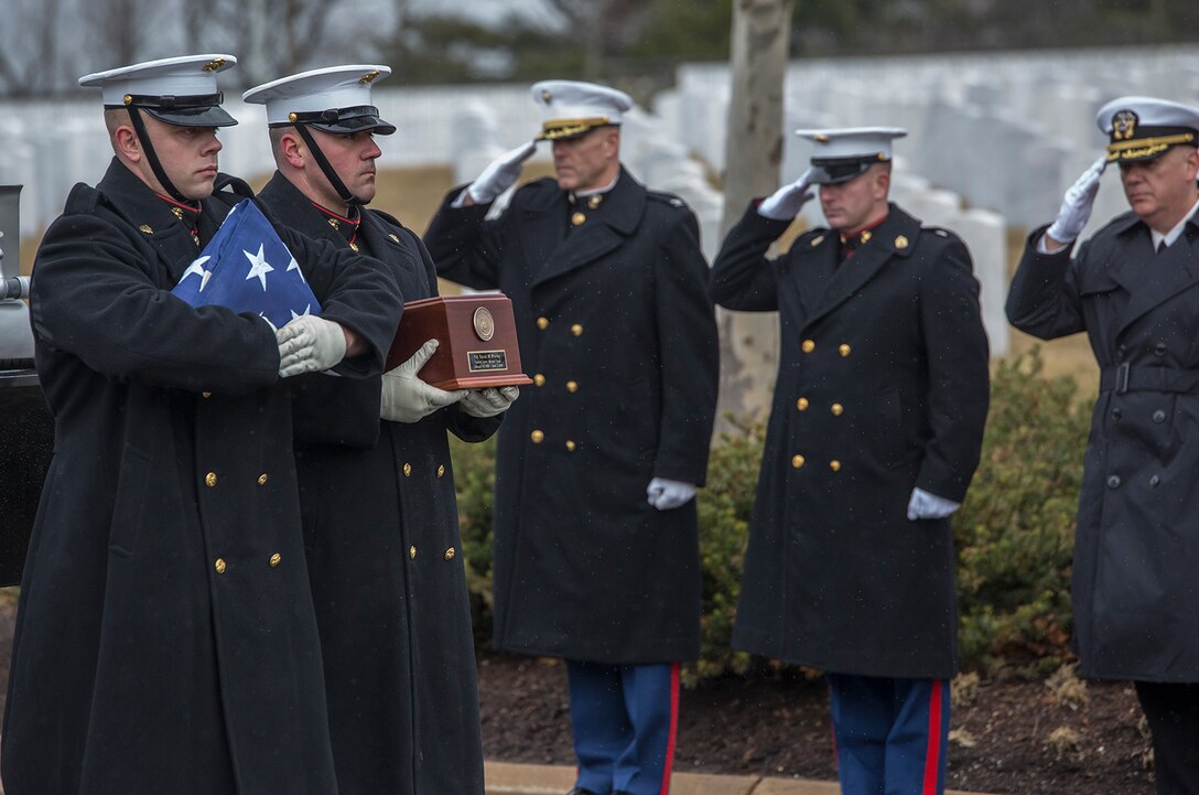 Marine Corps Body Bearers, Bravo Company, Marine Barracks Washington D.C., march with the folded National Flag and a standard urn during a full honors funeral for Col. Travis M. Provost at Arlington National Cemetery, Arlington, Va., Feb. 12, 2018. Provost joined the U.S. Marine Corps on November 10, 1989 and was commissioned as a 2nd Lieutenant in April 1990. He deployed six times, supporting multiple operations including Operation Iraqi Freedom in 2005 and retired in April 2014 after a distinguished and decorated career. (Official U.S. Marine Corps photo by Sgt. Robert Knapp/Released)