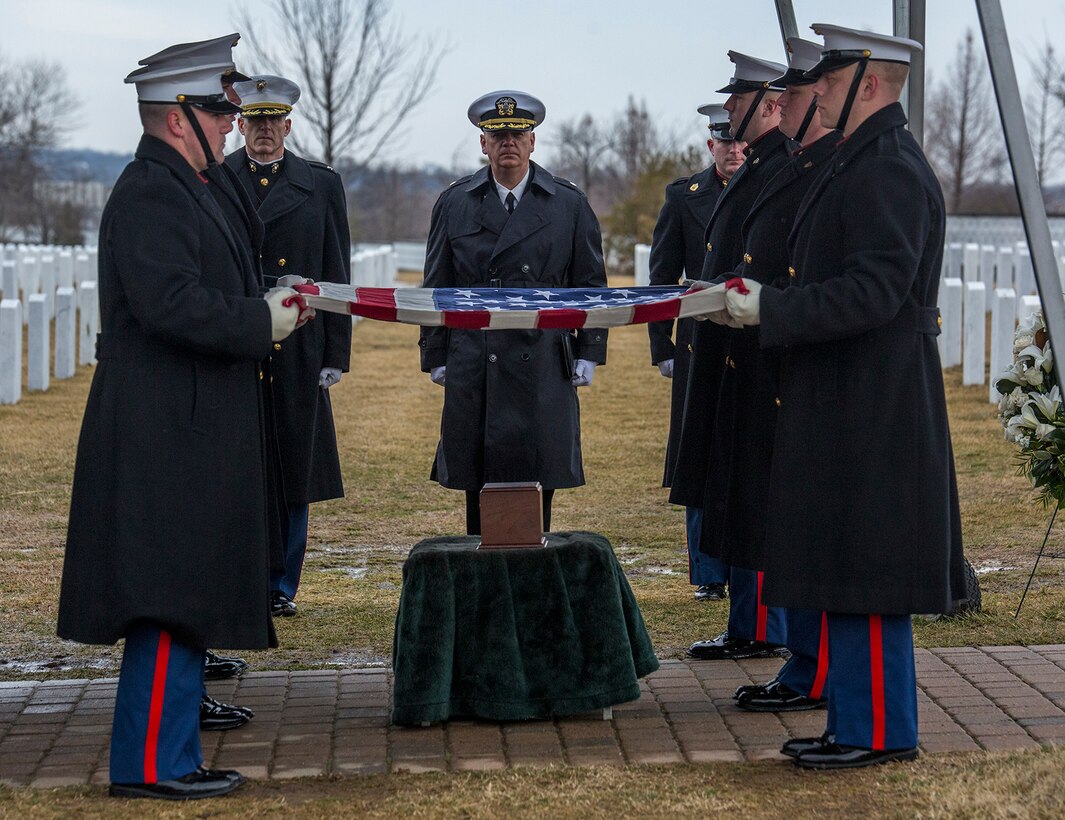 Marine Corps Body Bearers, Bravo Company, Marine Barracks Washington D.C., prepare to fold the National Flag during a full honors funeral for Col. Travis M. Provost at Arlington National Cemetery, Arlington, Va., Feb. 12, 2018. Provost joined the U.S. Marine Corps on November 10, 1989 and was commissioned as a 2nd Lieutenant in April 1990. He deployed six times, supporting multiple operations including Operation Iraqi Freedom in 2005 and retired in April 2014 after a distinguished and decorated career. (Official U.S. Marine Corps photo by Sgt. Robert Knapp/Released)