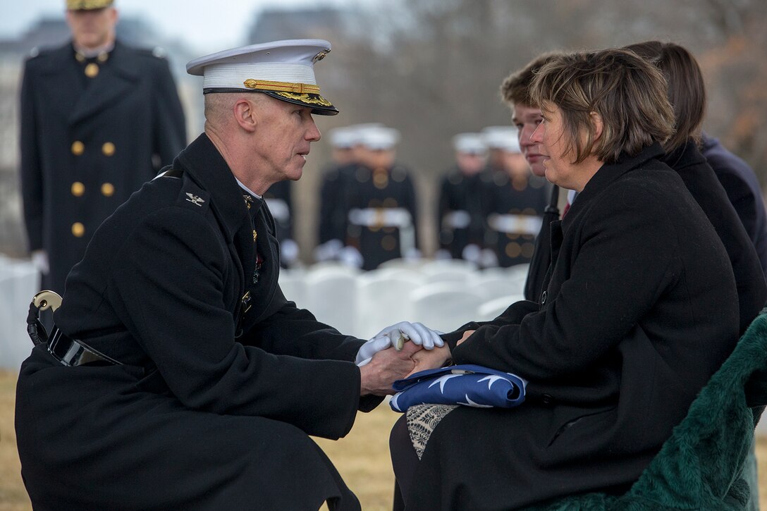 Colonel Tyler J. Zagurski, commanding officer, Marine Barracks Washington D.C., presents the National Flag to the next of kin during a full honors funeral for Col. Travis M. Provost at Arlington National Cemetery, Arlington, Va., Feb. 12, 2018. Provost joined the U.S. Marine Corps on November 10, 1989 and was commissioned as a 2nd Lieutenant in April 1990. He deployed six times, supporting multiple operations including Operation Iraqi Freedom in 2005 and retired in April 2014 after a distinguished and decorated career.  (Official U.S. Marine Corps photo by Sgt. Robert Knapp/Released)