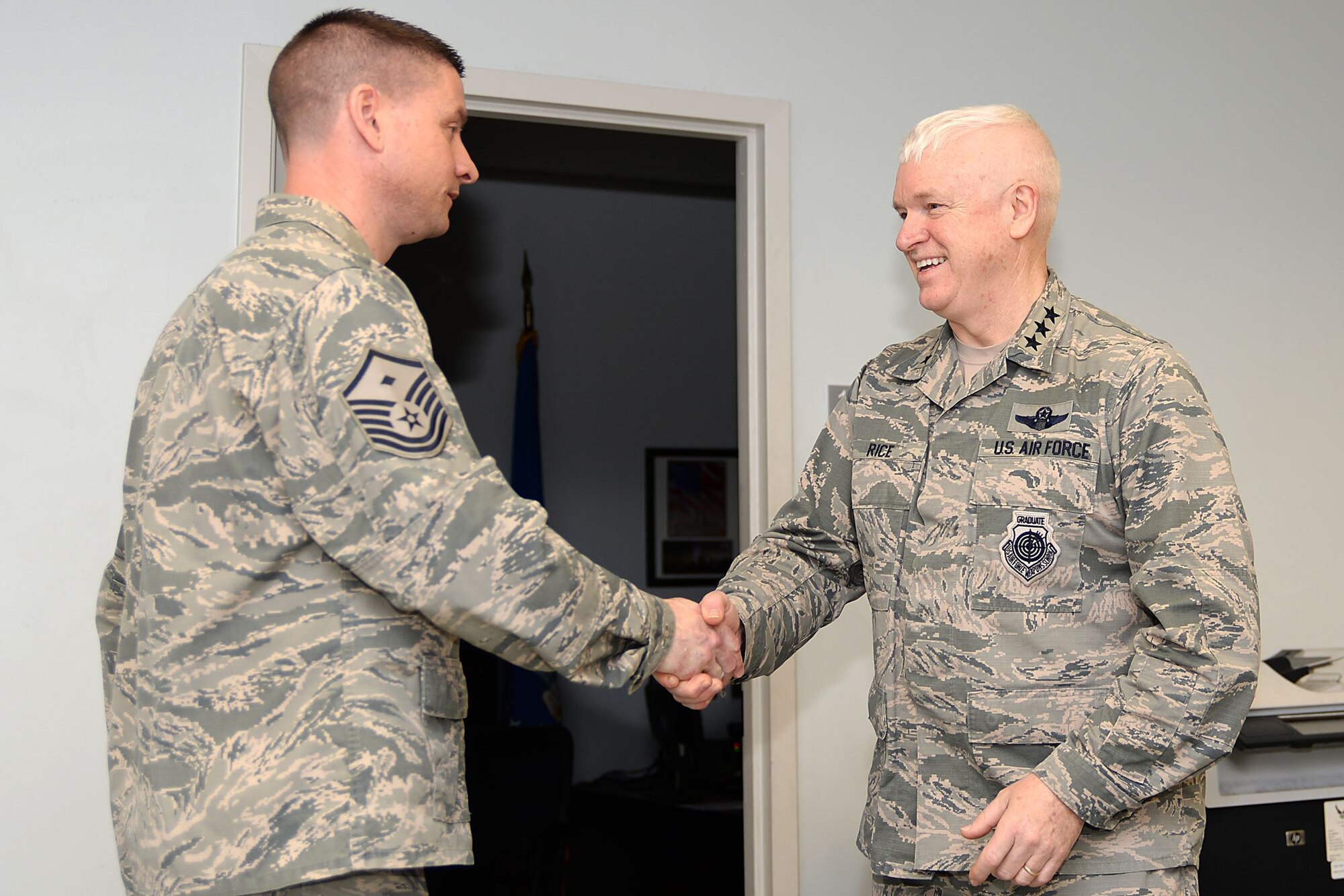 A picture of U.S. Air Force Lt. Gen. L. Scott Rice, director of the Air National Guard,shaking the hand of Master Sgt. David M. Burr, 177th Fighter Wing Maintenance Squadron First Sergeant.