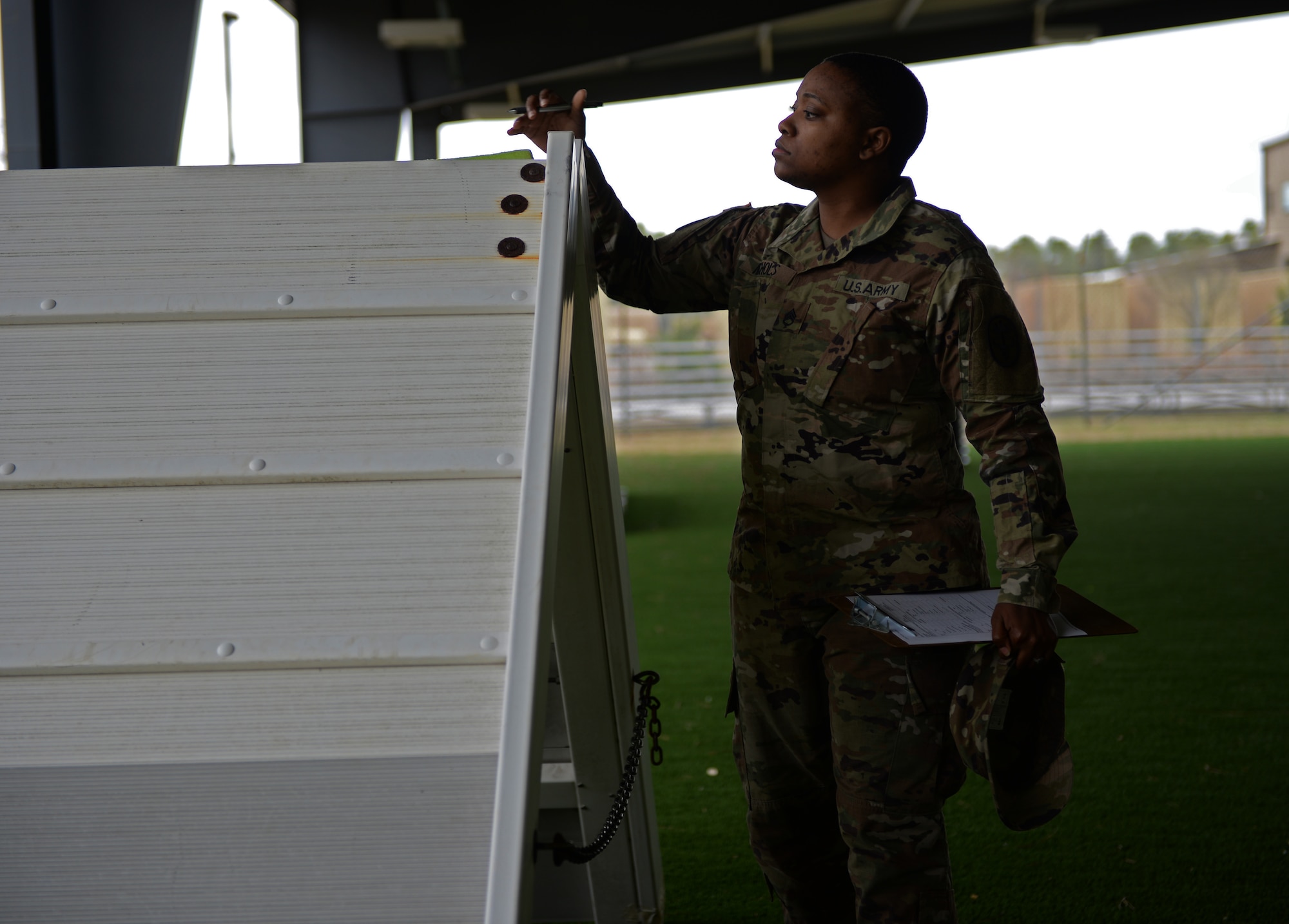 U.S. Army Staff Sgt. Constance Nicholsbingham, Fort Gordon Public Health noncommissioned officer in charge checks the military working dog training area at Shaw Air Force Base, S.C., Feb. 7, 2018.