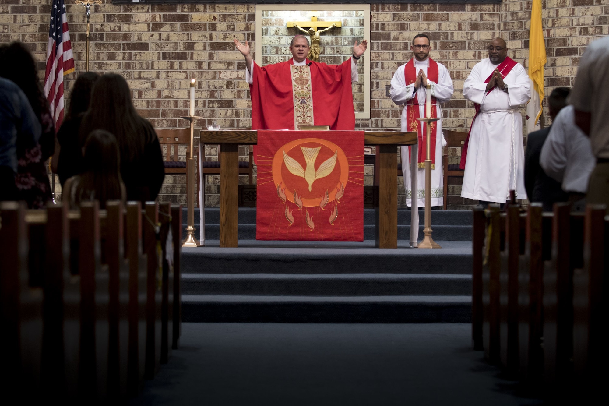 Bishop Robert J. Coyle, Archdiocese of the Military Services, addresses a sanctuary of people, shortly before performing a Sacrament of Confirmation ceremony, Feb. 12, 2018, at Moody Air Force Base, Ga. Confirmation is the sacrament by which Catholics believe the Holy Spirit gives them the increased ability to practice their faith in every aspect of their lives and to witness Christ in every situation.  The Sacrament of Confirmation helps a person remain faithful to his or her baptismal commitment to witness to Christ and to serve others. (U.S. Air Force photo by Senior Airman Daniel Snider)