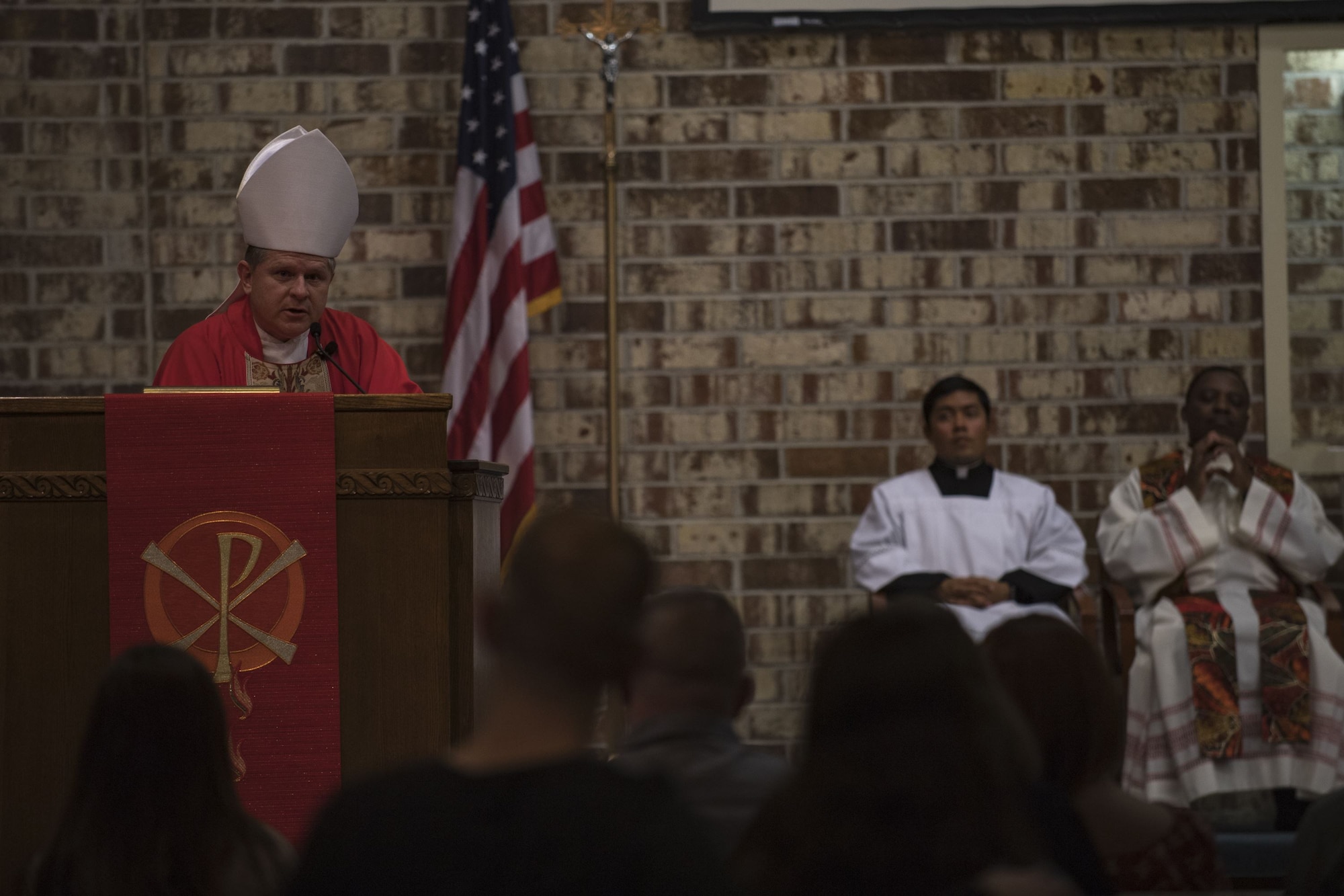 Bishop Robert J. Coyle, Archdiocese of the Military Services, addresses a sanctuary of people, shortly before performing a Sacrament of Confirmation ceremony, Feb. 12, 2018, at Moody Air Force Base, Ga. Confirmation is the sacrament by which Catholics believe the Holy Spirit gives them the increased ability to practice their faith in every aspect of their lives and to witness Christ in every situation.  The Sacrament of Confirmation helps a person remain faithful to his or her baptismal commitment to witness to Christ and to serve others. (U.S. Air Force photo by Senior Airman Daniel Snider)