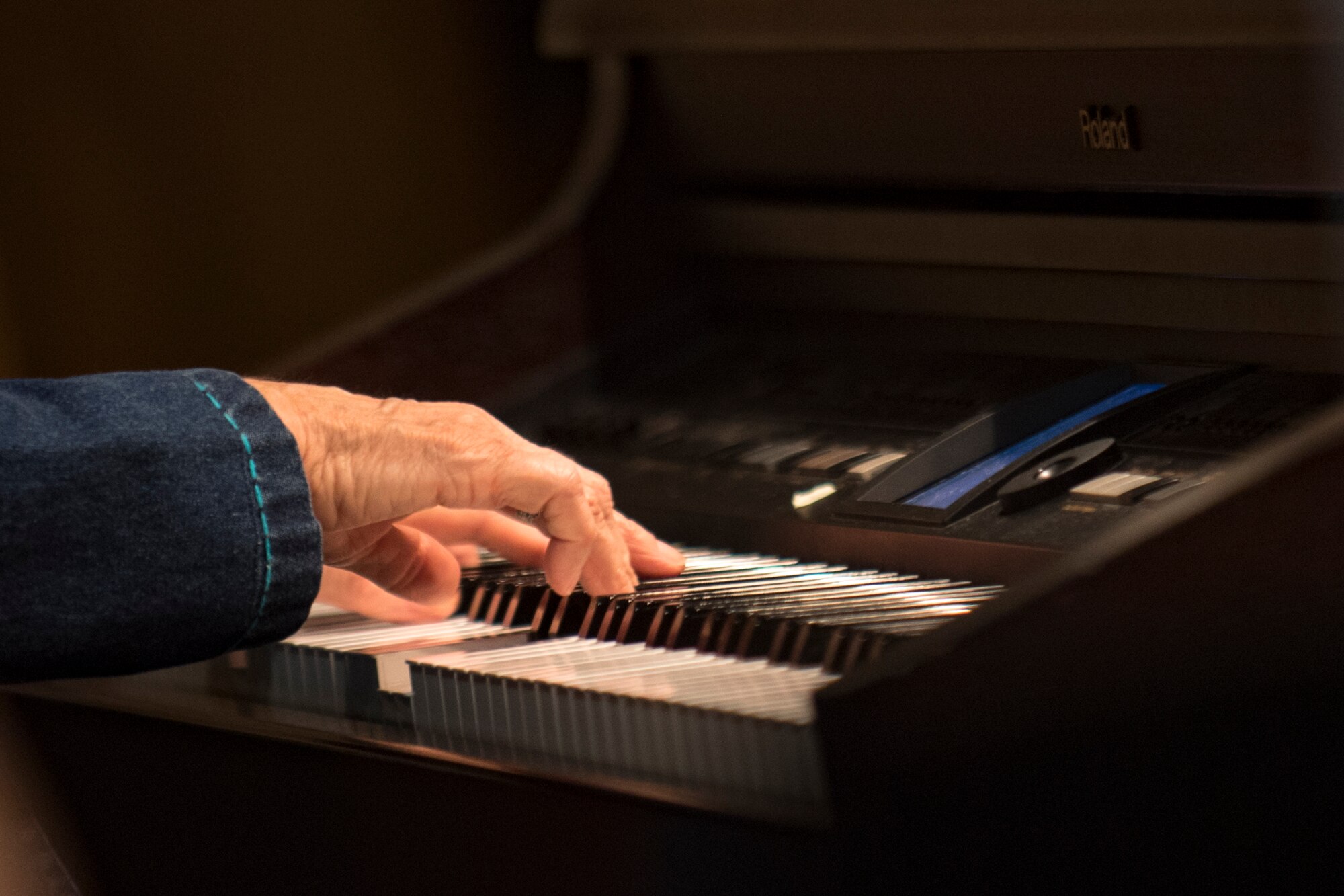 A pianist performs a hymn during a Sacrament of Confirmation ceremony performed by Bishop Robert J. Coyle, Archdiocese of the Military Services, Feb. 12, 2018, at Moody Air Force Base, Ga. Confirmation is the sacrament by which Catholics believe the Holy Spirit gives them the increased ability to practice their faith in every aspect of their lives and to witness Christ in every situation.  The Sacrament of Confirmation helps a person remain faithful to his or her baptismal commitment to witness to Christ and to serve others. (U.S. Air Force photo by Senior Airman Daniel Snider)