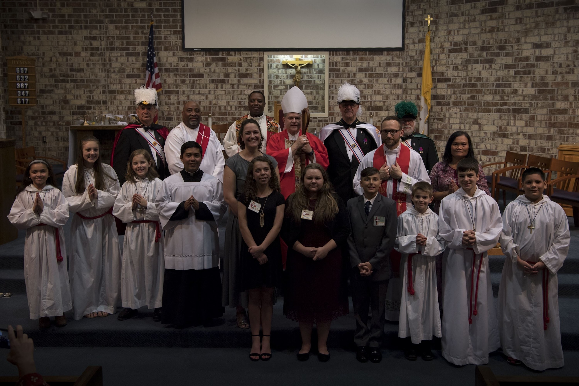 Members of  the Catholic community pose for a group photo with Bishop Robert J. Coyle, Archdiocese of the Military Services, after a Sacrament of Confirmation ceremony, Feb. 12, 2018, at Moody Air Force Base, Ga.