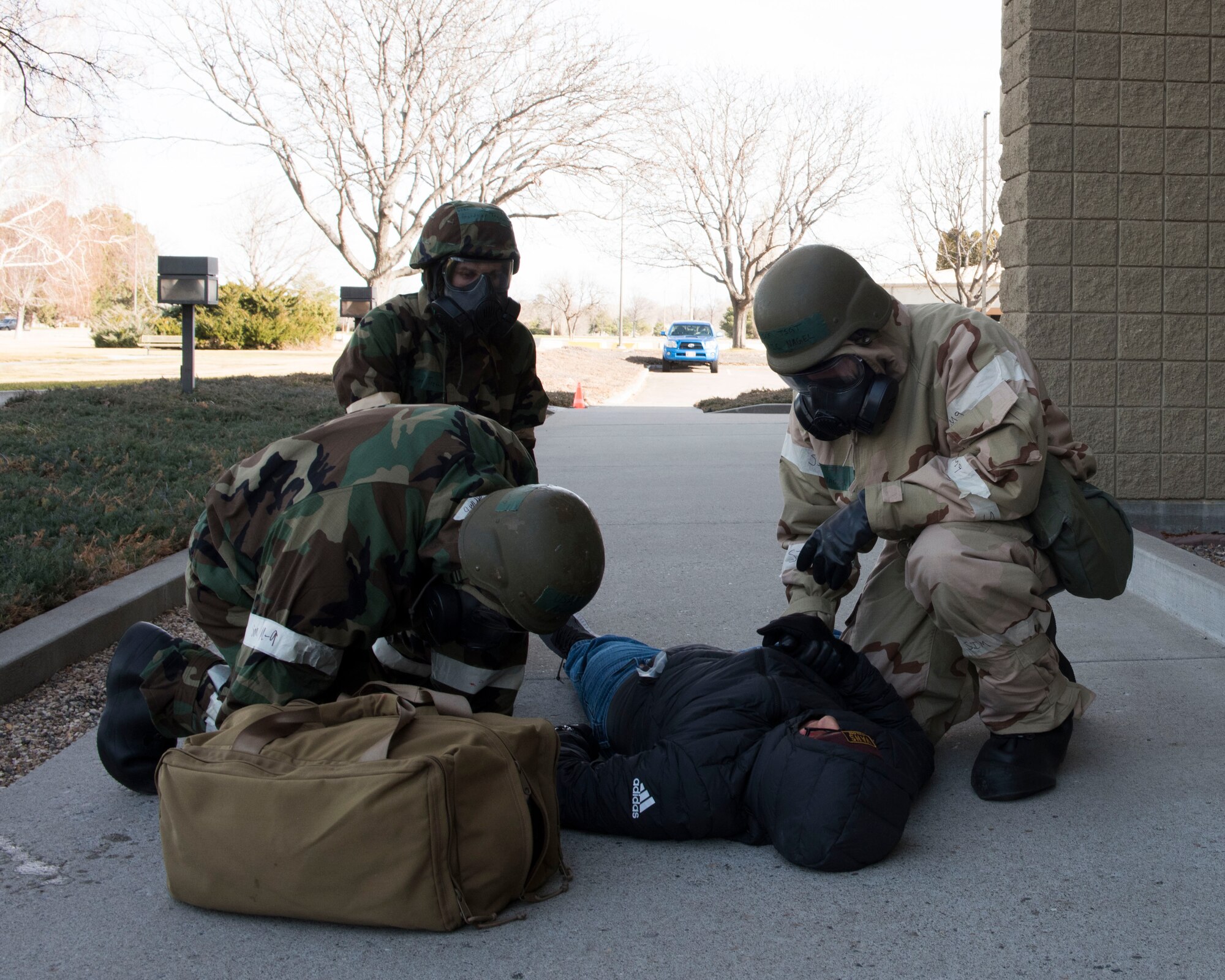 Image of 366th Fighter Wing Airmen treat a simulated victim while conducting a post-attack reconnaissance during exercise Gunslinger 18-4 Feb. 7, 2018, at Mountain Home Air Force Base, Idaho. The base participated in a week-long exercise to train for potential real-world contingencies. (U.S. Air Force photo by Airman 1st Class Alaysia Berry)