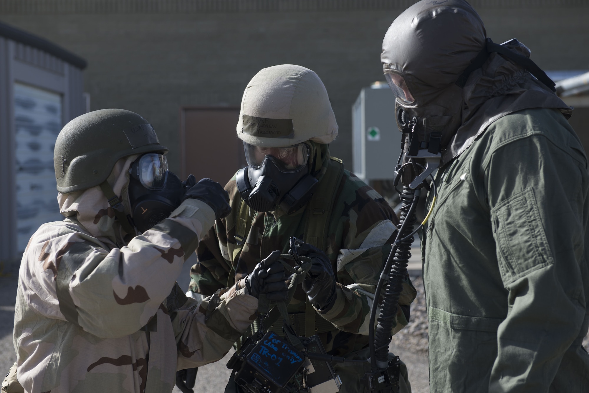 Image of 366th Operations Support Squadron Airmen take a 366th Fighter Wing pilot to the next decontamination station Feb. 7, 2018, at Mountain Home Air Force Base, Idaho. The base participated in a week-long exercise to train for potential real-world contingencies. (U.S. Air Force photo by Airman 1st Class JaNae Capuno)