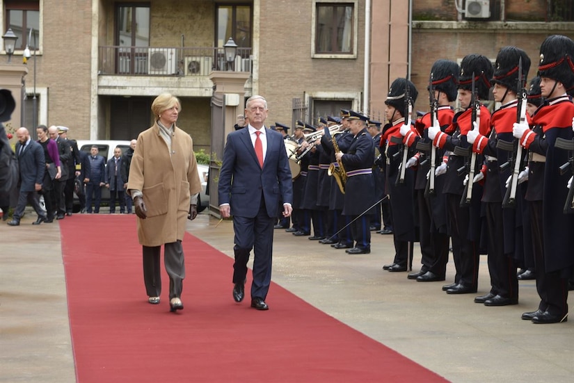 Defense Secretary James N. Mattis walks with Italian Defense Minister Roberta Pinotti in Rome.