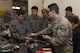 U.S. Air Force Senior Airman David Petrich, 374th Maintenance Squadron aircraft metals technology journeyman, showcases the tungsten carbide used in metals technology to Koku Jietai Cadets at a Basic Maintenance Officer Tour at Yokota Air Base, Japan, Feb. 1, 2018.