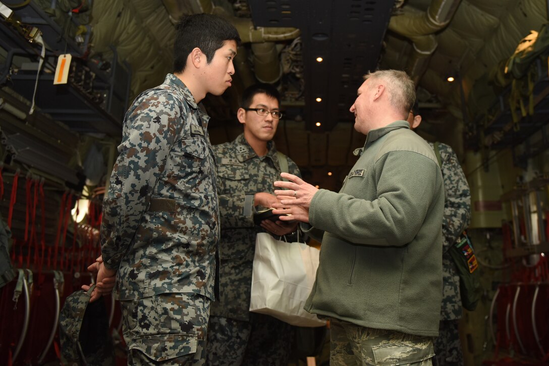 U.S. Air Force Capt. James Guthrie, maintenance exchange officer assigned to the Japanese Air Self-Defense Force’s First Technical School at Hamamatsu Air Base, discusses maintenance principles with Koku Jietai Cadets within a C-130J Super Hercules at Yokota Air Base, Japan, Feb. 1, 2018.