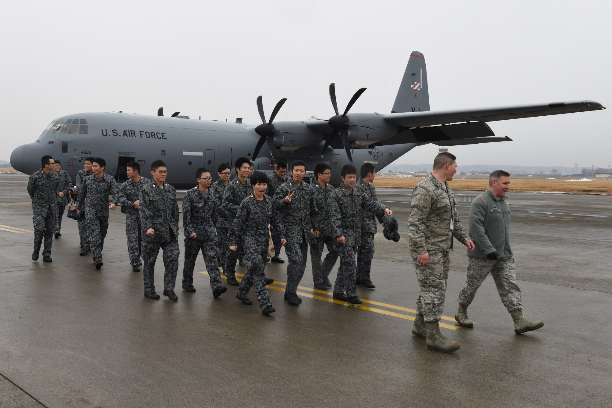 U.S. Air Force 2nd Lt. Jake Jackson, 374th Aircraft Maintenance Squadron assistant aircraft maintenance unit officer in charge, leads a Basic Maintenance Officer Tour off of the flightline after viewing the C-130J Super Hercules at Yokota Air Base, Japan, Feb. 1, 2018.
