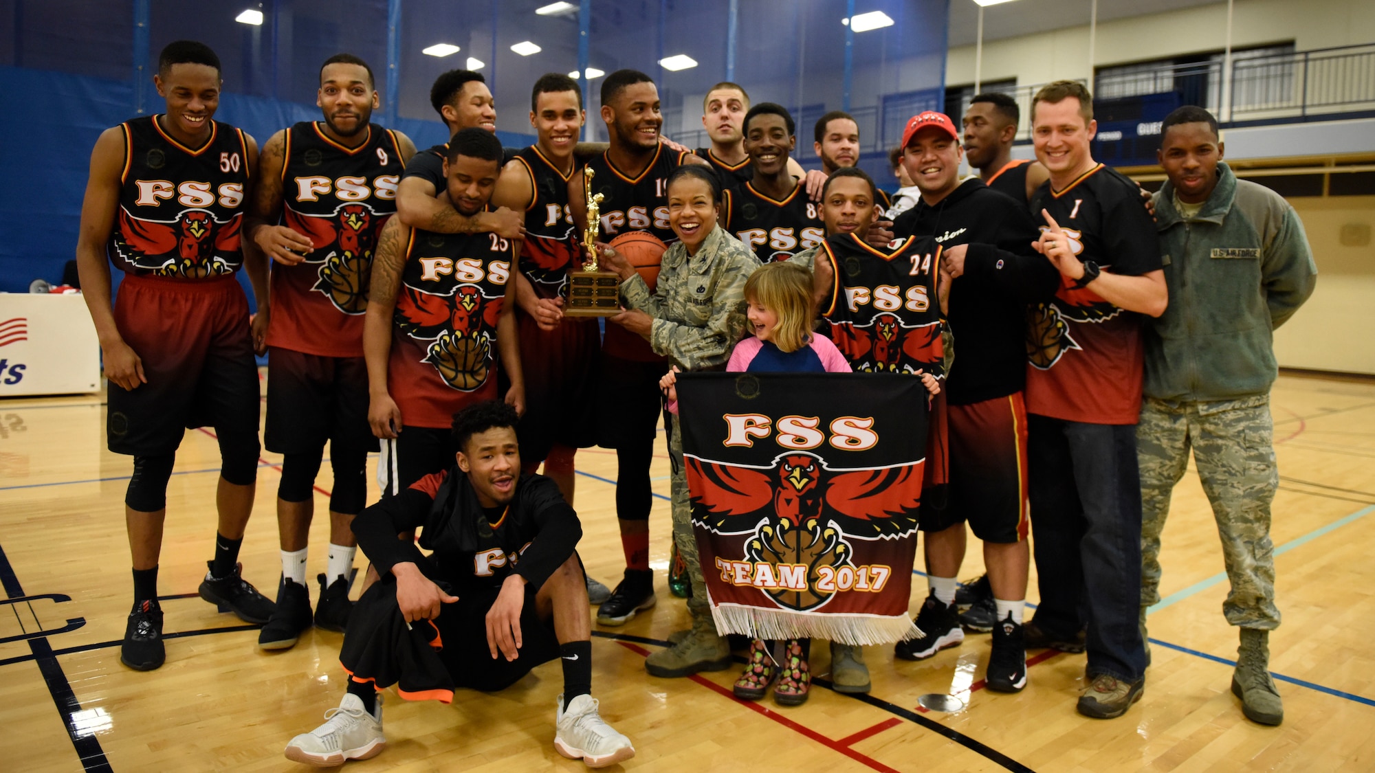 The 92nd Force Support Squadron Intramural Basketball championship team poses for a group shot after their final victory at Fairchild Air Force Base, Washington, Feb. 7, 2018. Teams from across the base competed over the course of 10 weeks of gameplay. (U.S. Air Force photo/ Airman 1st Class Jesenia Landaverde)