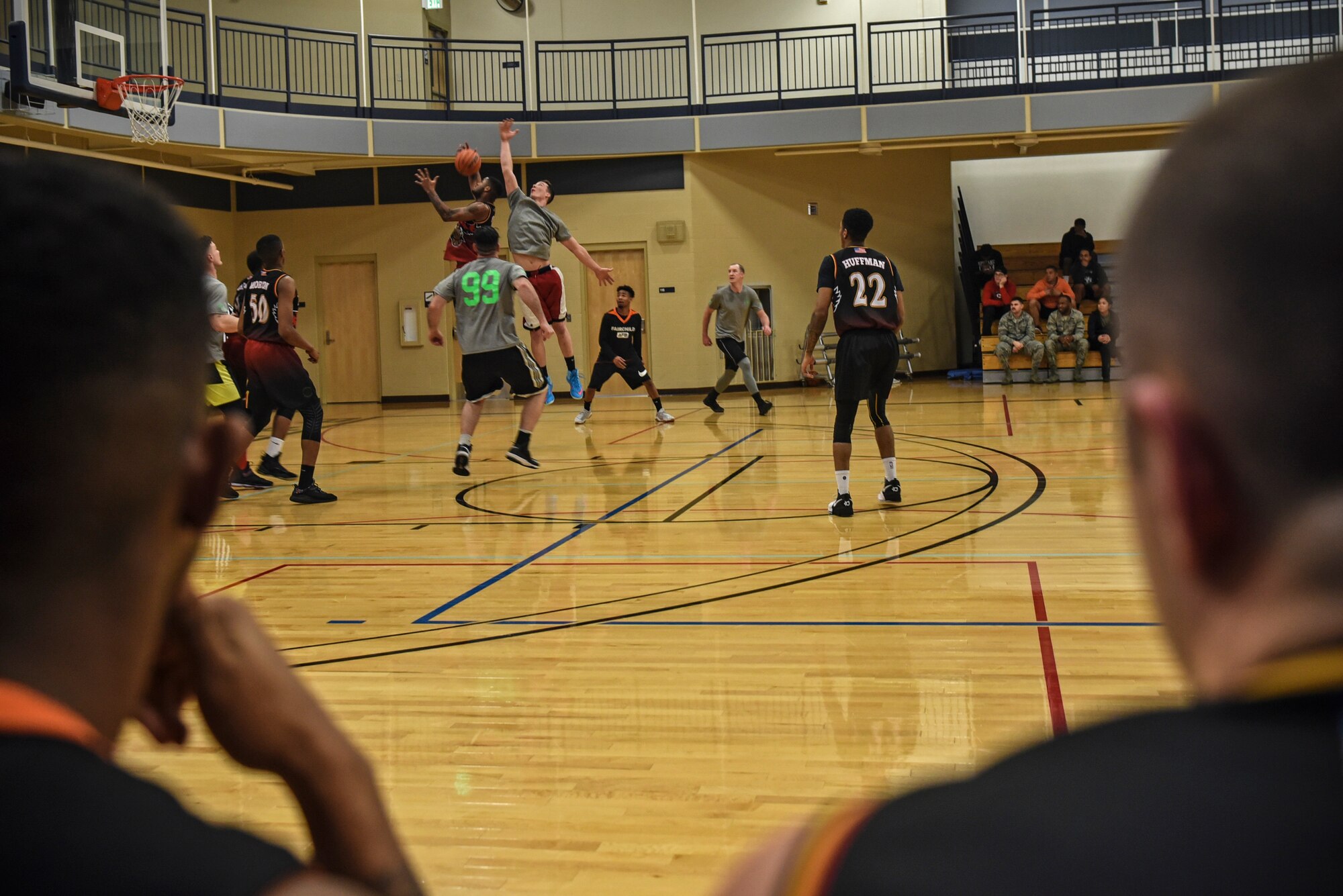 The 92nd Force Support Squadron and the 336th Training Group basketball temas compete in the Intramural Basketball championship Feb. 7, 2018, at Fairchild Air Force Base, Washington. The 92nd FSS held the lead during both halves with the 336th TRG close behind. (U.S. Air Force photo/ Airman 1st Class Whitney Laine)