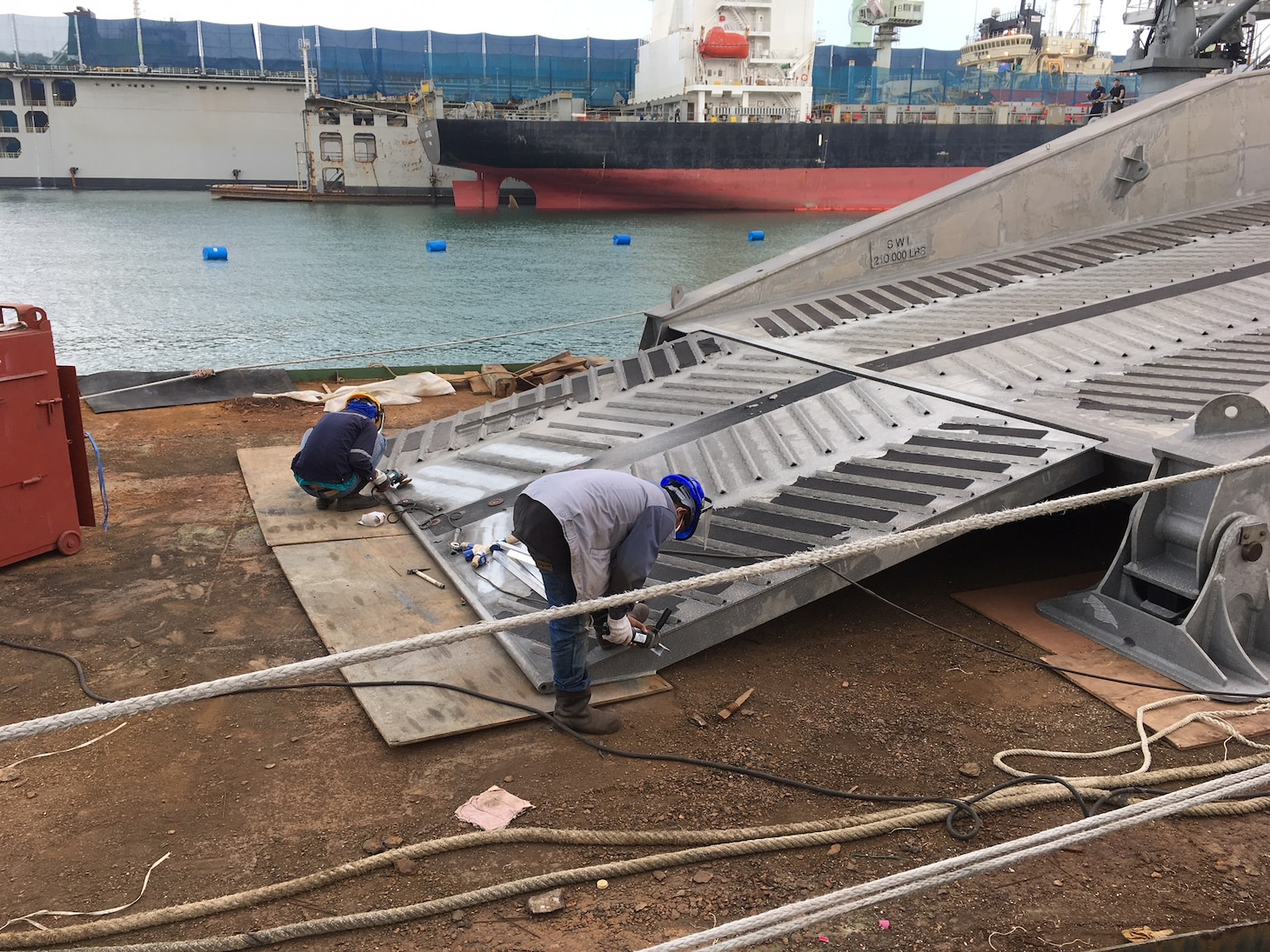 The expeditionary fast transport ship USNS Fall River (T-EPF-4) conducts weld repairs on the stern ramp during a voyage repair availability in Laem Chabang, Thailand, Feb. 12. Fall River is assigned to Destroyer Squadron 7 in U.S. 7th Fleet area of responsibility, providing logistical solutions to the region's littorals and working hull-to-hull with partner navies to provide 7th Fleet with the flexible capabilities it needs now and in the future.