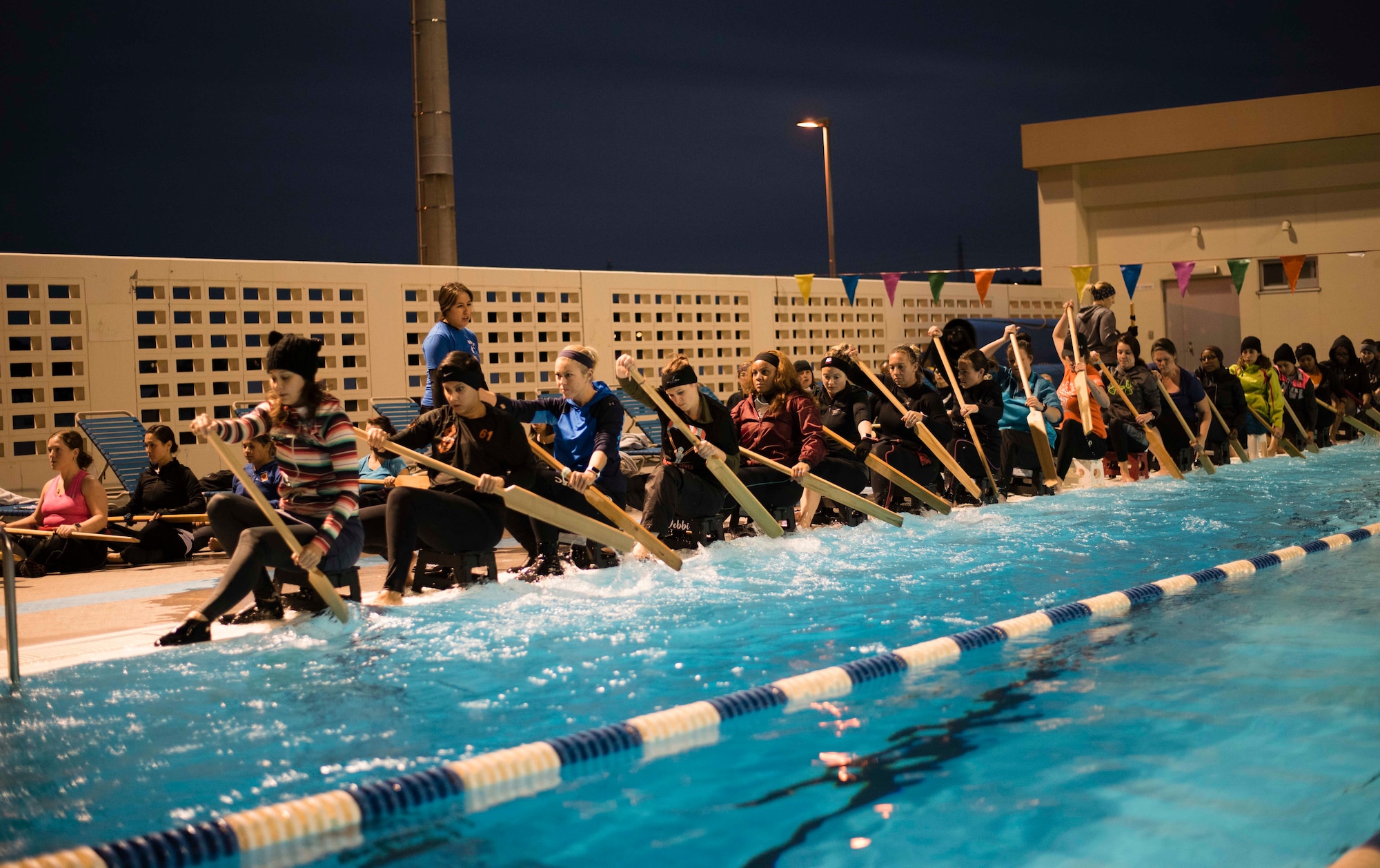 Water ripples through the pool as the Kadena Shoguns Women’s Dragon Boat team practices at the Fairchild Pool Feb. 7, 2018, at Kadena Air Base, Japan. The dragon boat teams, composed of 32 rowers, row fiberglass boats painted to resemble mythical seafaring dragons. (U.S. Air Force photo by Senior Airman Omari Bernard)
