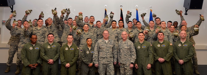 Graduates of the Phoenix Raven Qualification Course pose for a class photo with their instructors and and leadership on Ramstein Air Base, Germany, on Feb. 12, 2018. U.S. Air Forces in Europe-Air Forces Africa and 86th Airlift Wing leadership requested a mobile training team to come and direct the Raven course at Ramstein. (U.S. Air Force photo by Senior Airman Joshua Magbanua)