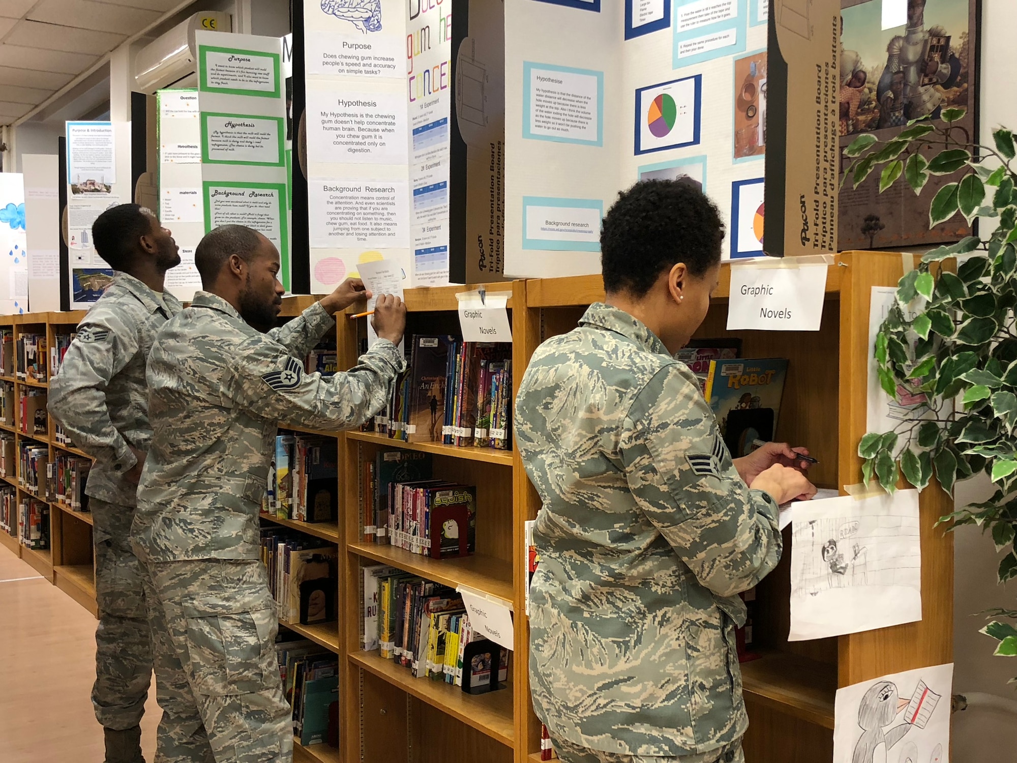 U.S. Air Force Airmen in a library