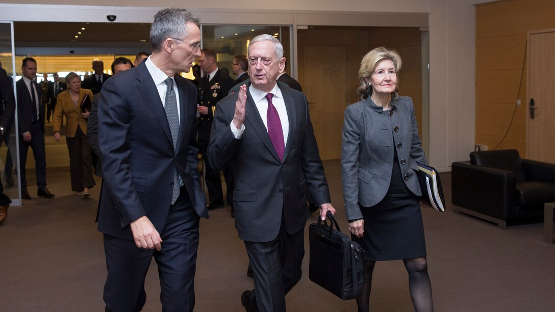 Defense Secretary James N. Mattis walks with  NATO leaders in Brussels.
