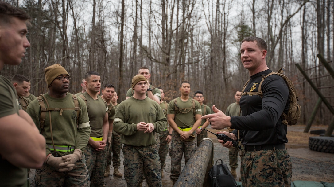 U.S. Marine Corps Staff Sgt. Joshua Owen (right), explains the conduct of the Force Fitness Instructor (FFI) Course culminating event at The Basic School, Marine Corps Base Quantico, Va., February 12, 2018. The FFI course is made up of physical training, classroom instruction and practical application to provide the students with a holistic approach to fitness. Upon completion, the Marines will serve as unit FFIs, capable of designing individual and unit-level holistic fitness programs.