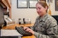 Master Sgt. Misti Rodriguez, Academic Coding Branch superintendent, inputs a transcript into the Air Force Military Personnel Data System to update an officer's record. Two Airmen at the Coding Branch, including Rodriguez, update more than 1,000 transcripts a month in support of some 130,000 total force Air Force officers.  (U.S. Air Force photo/John Harrington)