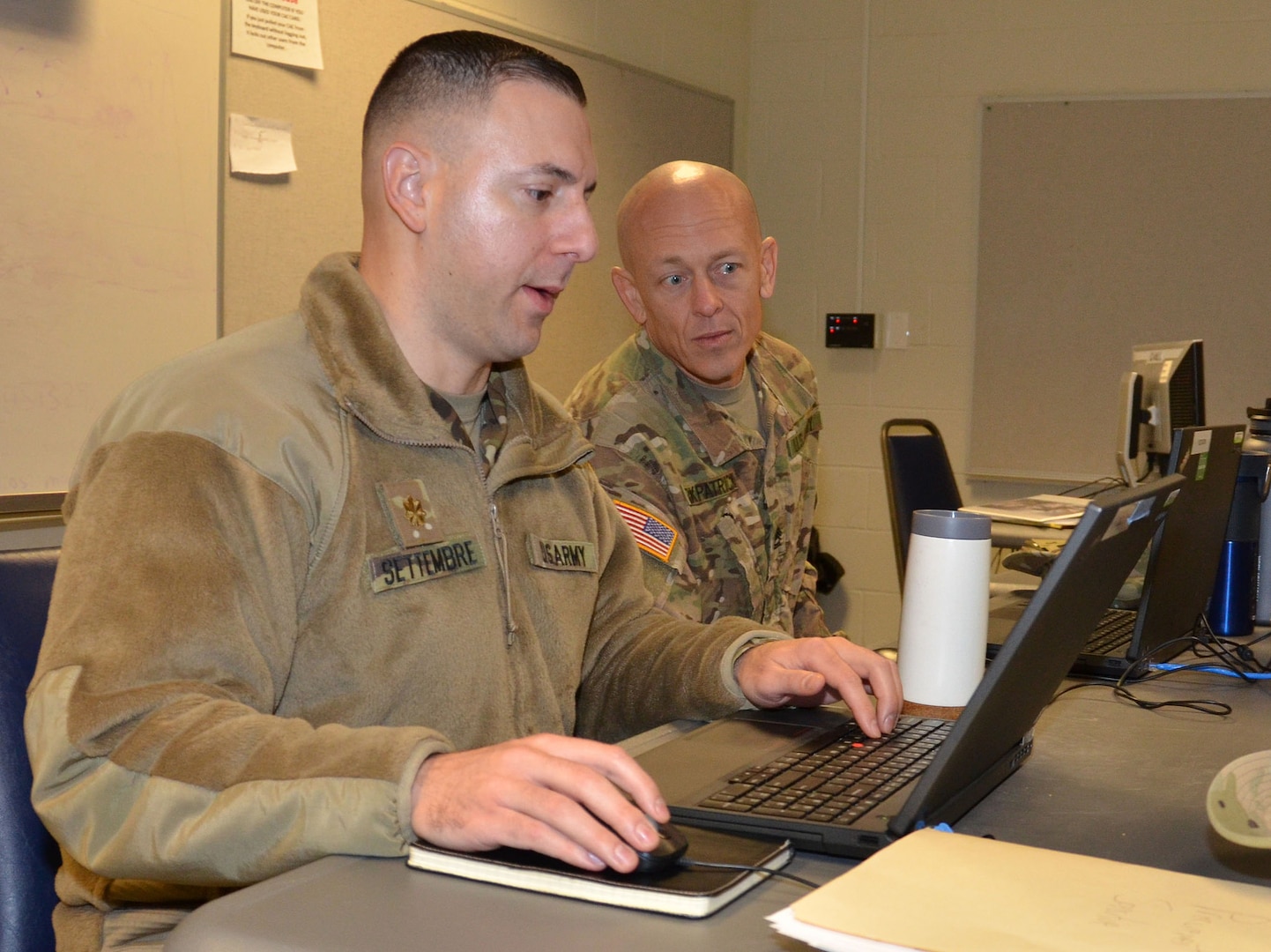 Sgt. 1st Class Bonifacio Magdaleno (right) and Maj. Joe Cederstrom evaluate contracting support during a humanitarian assistance disaster relief exercise Feb. 8 at Joint Base San Antonio-Camp Bullis. Magdaleno is assigned to the 418th Contracting Support Brigade at Fort Hood, Texas, and Cederstrom is a full-time Texas Army National Guardsman with the 1936th Contingency Contracting Battalion from Camp Mabry, near Austin, Texas.