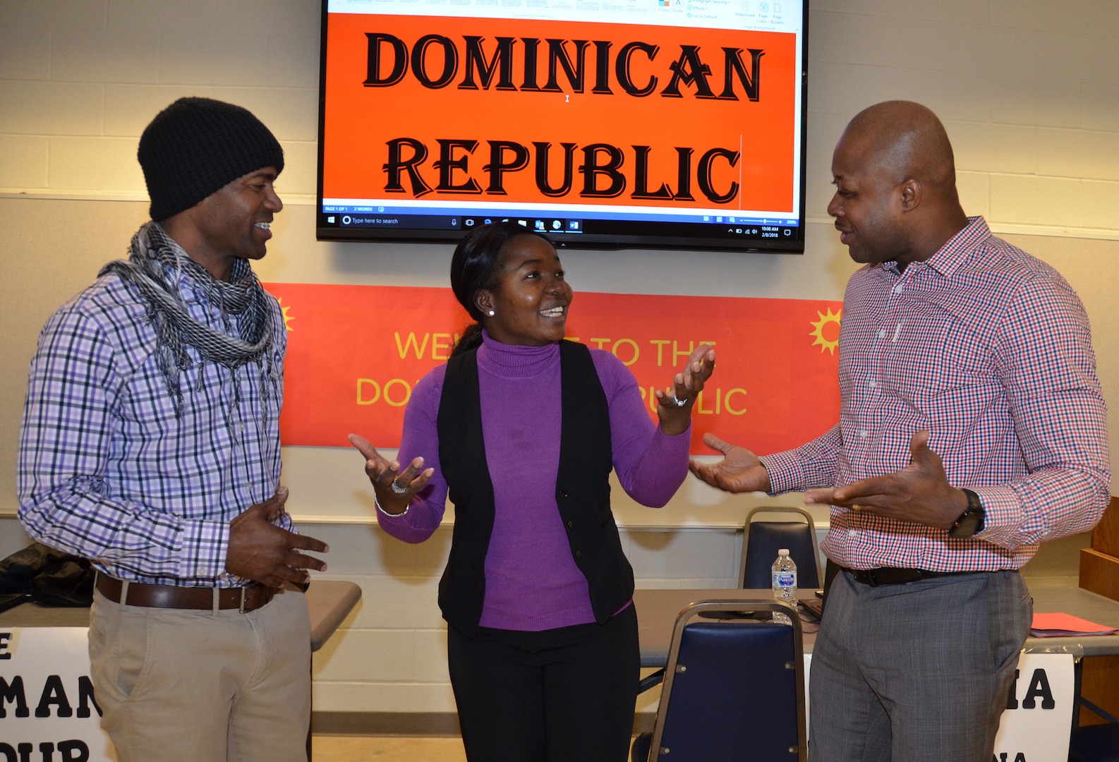 (From left) Staff Sgt. Derbe Amiah, Staff Sgt. Catherine Johnson and Chief Warrant Officer 3 Kortney Johnson role play as Dominican Republic vendors during a humanitarian assistance disaster relief exercise Feb. 8 at Joint Base San Antonio-Camp Bullis. Amiah is a contract specialist, Sgt. Johnson is a contracting officer and CW3 Johnson is the property book officer for the 410th Contracting Support Brigade at JBSA-Fort Sam Houston.