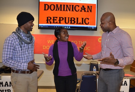 (From left) Staff Sgt. Derbe Amiah, Staff Sgt. Catherine Johnson and Chief Warrant Officer 3 Kortney Johnson role play as Dominican Republic vendors during a humanitarian assistance disaster relief exercise Feb. 8 at Joint Base San Antonio-Camp Bullis. Amiah is a contract specialist, Sgt. Johnson is a contracting officer and CW3 Johnson is the property book officer for the 410th Contracting Support Brigade at JBSA-Fort Sam Houston.