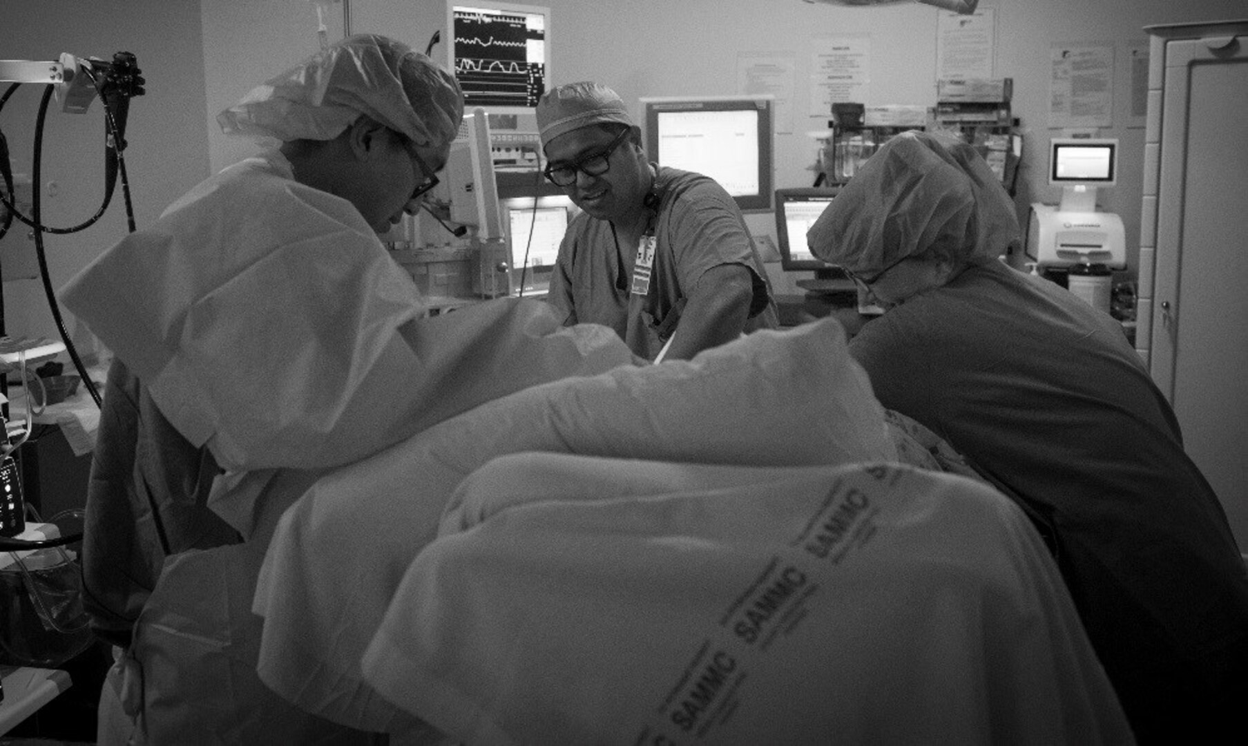 Surgical technicians from the 59th Medical Wing, prepare a patient for a colonoscopy, January 10, 2017 at Joint Base San Antonio-Lackland, Texas. The can provide patients timely screenings to detect gastro related illnesses, including cancer.