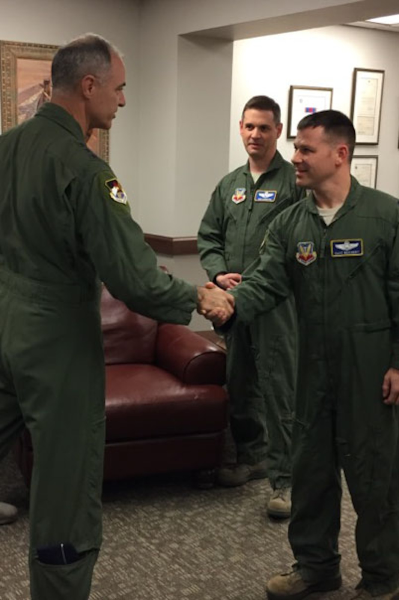 MAXWELL AIR FORCE BASE, Ala. - Lt. Gen. R. Scott Williams, Commander, Continental NORAD Region- 1st Air Force (Air Forces Northern), presents his commander’s coin for outstanding performance to Lt. Col. Dave Reichert, Director of Operations, Civil Air Patrol – U.S. Air Force, during Williams’ visit to the headquarters Feb. 7. (Air Force Photo by Capt. Emily Meredith)