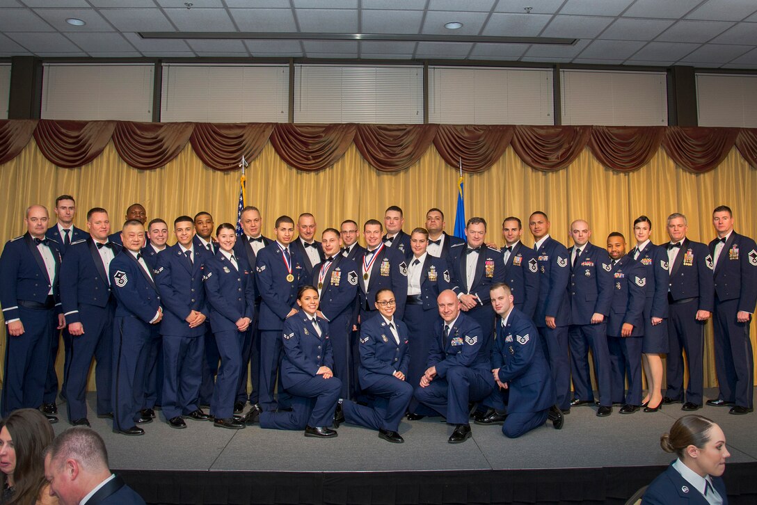 Award winners pose for a picture during the 514th Air Mobility Wing's annual awards banquet Feb. 10.