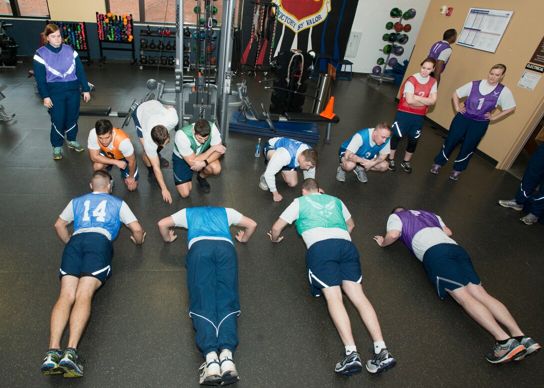 U.S. Airmen at the 20th Force Support Squadron main fitness center perform pushups while fitness assessment augmentees observe form at Shaw Air Force Base, S.C., Feb. 12, 2018.