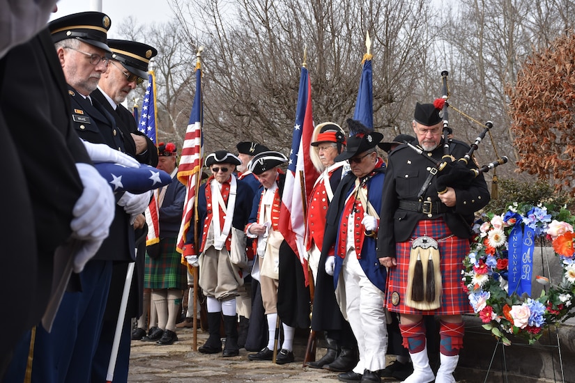 Soldiers and service members past and present, along with citizens in 18th century uniforms and attire, present flags and wreaths during a ceremony honoring the 245th birthday of our 9th President, William Henry Harrison, Feb. 9, in North Bend, Ohio.