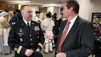 Major Gen. Patrick Reinert, 88th Readiness Division commanding general, speaks with Doug Sammons, mayor of the Village of North Bend, before a ceremony honoring the 245th birthday of our 9th President, William Henry Harrison, Feb. 9, in North Bend, Ohio.