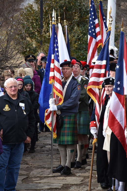 Local citizens and The Sons and Daughters of the American Revolution stand along with students from the Three Rivers Educational Campus during a ceremony honoring the 245th birthday of our 9th President, William Henry Harrison, Feb. 9, in North Bend, Ohio.