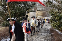 A procession of Soldiers and service members past and present, along with relatives, local officials and citizens in 18th century uniforms and attire, march through the Village of North Bend, Ohio, to the tomb of William Henry Harrison, Feb. 9, to honor our 9th President's 245th birthday.