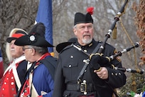 A bagpipe player prepares to play a ceremony honoring the 245th birthday of our 9th President, William Henry Harrison, Feb. 9, in North Bend, Ohio.