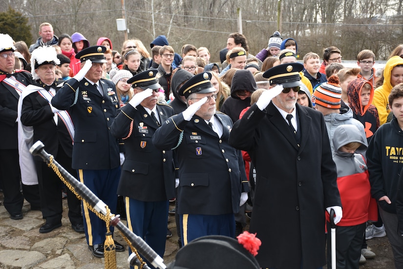 Local officials and retired U.S. Army Soldiers salute for a ceremony honoring the 245th birthday of our 9th President, William Henry Harrison, Feb. 9, in North Bend, Ohio.