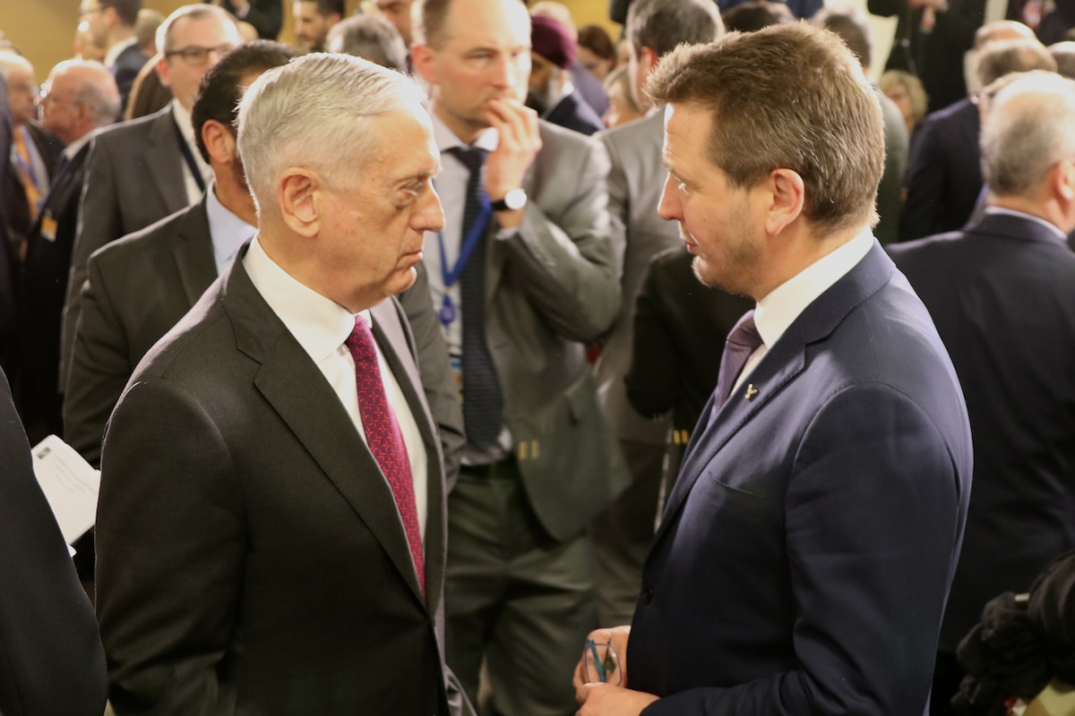 Defense Secretary James N. Mattis speaks with the Icelandic defense minister.