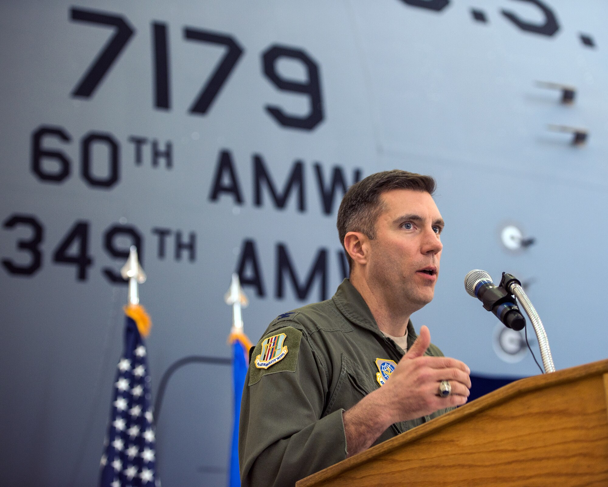 U.S. Air Force Col. John Klein 60th Air Mobility Wing commander, provides remarks during the 75th Anniversary kickoff celebration at Travis Air Force Base, Calif., Feb. 8, 2018. The celebration featured the inaugural unveiling of the 75th Anniversary logo on a C-17 Globemaster III. Travis is celebrating 75 years as a major strategic logistics hub for the Pacific and integral part of global power projection for the total force. (U.S. Air Force photo by Louis Briscese)
