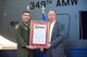 State Senator Bill Dodd (D-Napa), 3rd Senate District, presents U.S. Air Force Col. John Klein, 60th Air Mobility Wing commander a certificate during the 75th Anniversary kickoff celebration at Travis Air Force Base, Calif., Feb. 8, 2018. The celebration featured the inaugural unveiling of the 75th Anniversary logo on a C-17 Globemaster III. Travis is celebrating 75 years as a major strategic logistics hub for the Pacific and integral part of global power projection for the total force. (U.S. Air Force photo by Louis Briscese)